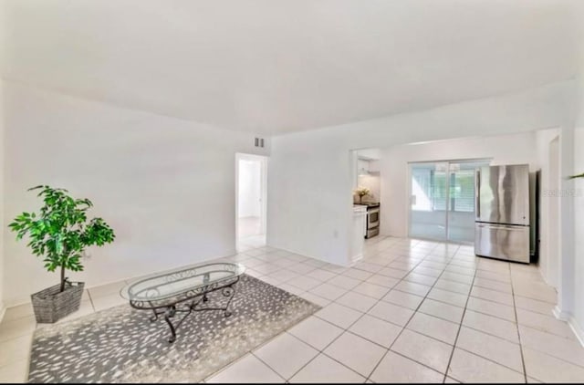 7313 Royal Palm Dr, New Port Richey, FL 34652 - spare room featuring light tile patterned flooring and baseboards