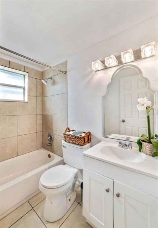 7313 Royal Palm Dr, New Port Richey, FL 34652 - full bathroom featuring toilet, vanity, tile patterned floors, and bathtub / shower combination