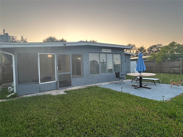 7313 Royal Palm Dr, New Port Richey, FL 34652 - back of house featuring a patio and stucco siding