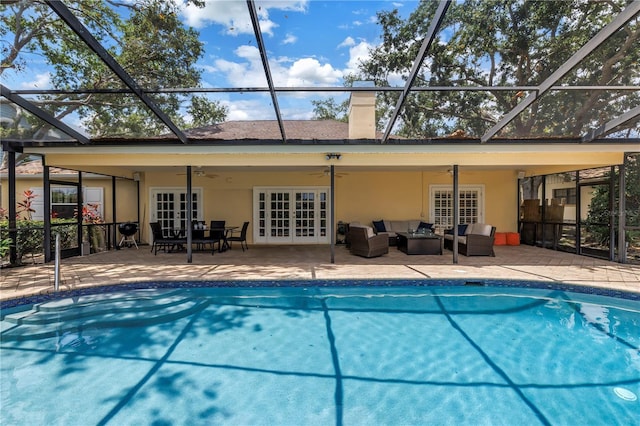 8127 Siquita Dr NE, Saint Petersburg, FL 33702 - swimming pool featuring french doors, an outdoor living space, ceiling fan, and a patio