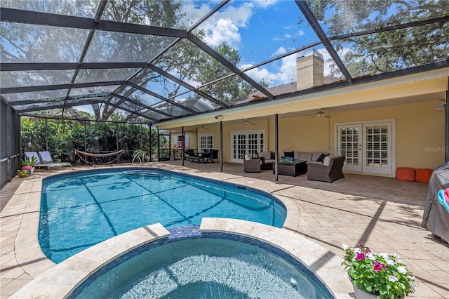 8127 Siquita Dr NE, Saint Petersburg, FL 33702 - view of pool with french doors, an outdoor living space, ceiling fan, a patio, and a pool with connected hot tub