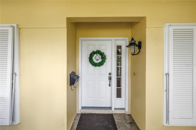 8127 Siquita Dr NE, Saint Petersburg, FL 33702 - property entrance with stucco siding