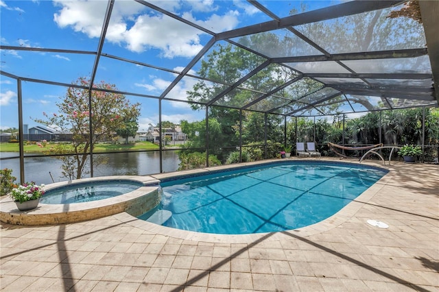 8127 Siquita Dr NE, Saint Petersburg, FL 33702 - view of pool featuring a pool with connected hot tub, a patio area, a water view, and a lanai