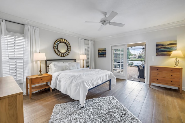 8127 Siquita Dr NE, Saint Petersburg, FL 33702 - bedroom featuring ornamental molding, access to outside, wood finished floors, ceiling fan, and baseboards