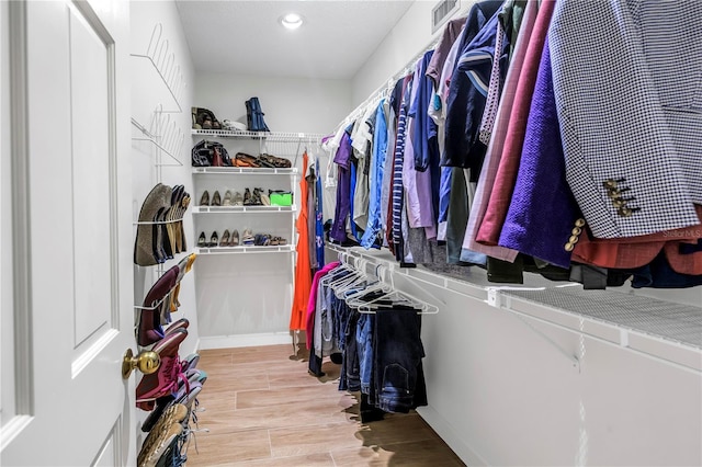 8127 Siquita Dr NE, Saint Petersburg, FL 33702 - walk in closet featuring wood finished floors