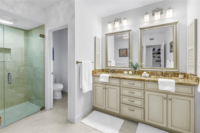 8127 Siquita Dr NE, Saint Petersburg, FL 33702 - bathroom with a stall shower, toilet, double vanity, a closet, and tile patterned flooring