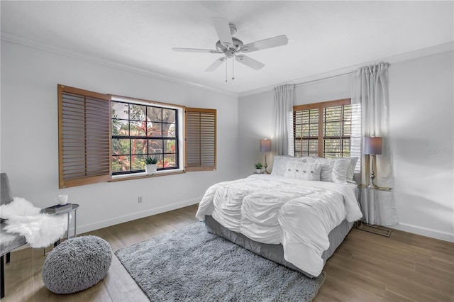 8127 Siquita Dr NE, Saint Petersburg, FL 33702 - bedroom featuring ornamental molding, baseboards, wood finished floors, and a ceiling fan