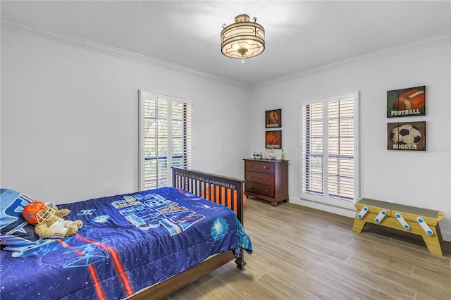 8127 Siquita Dr NE, Saint Petersburg, FL 33702 - bedroom with crown molding, wood finished floors, and baseboards