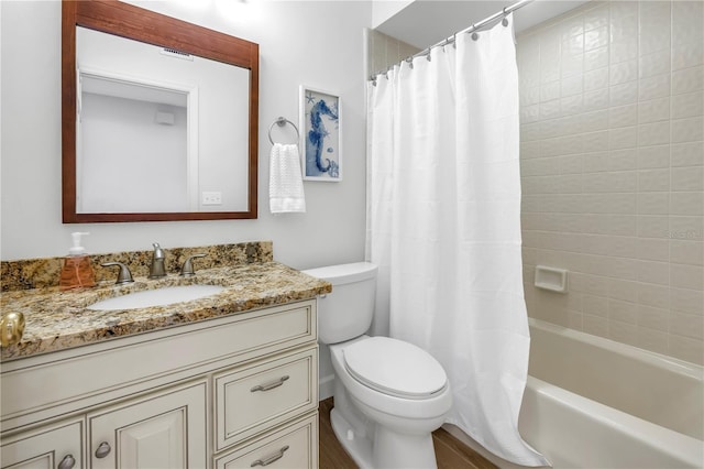 8127 Siquita Dr NE, Saint Petersburg, FL 33702 - bathroom featuring toilet, vanity, and shower / tub combo with curtain