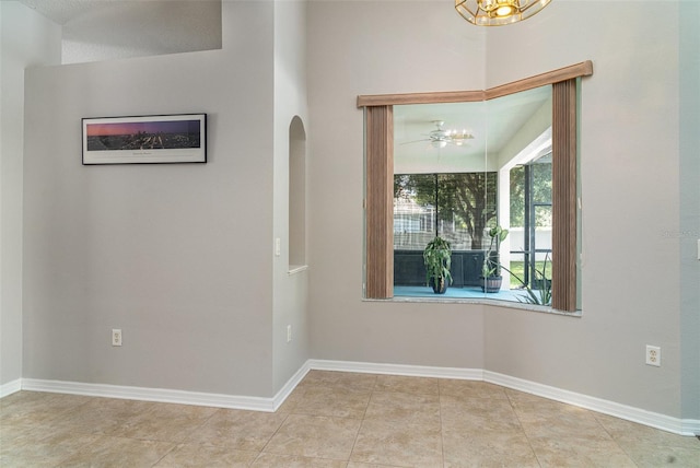 14266 Creek Run Dr, Riverview, FL 33579 - unfurnished room with baseboards, arched walkways, and tile patterned flooring