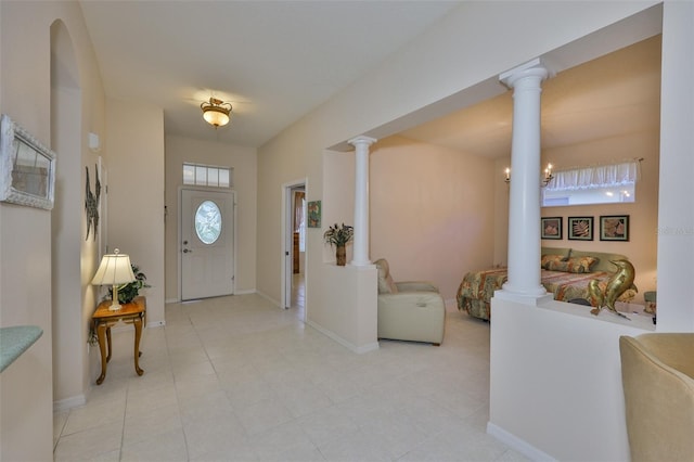 2128 Worthington Greens Dr, Sun City Center, FL 33573 - entryway featuring ornate columns and baseboards
