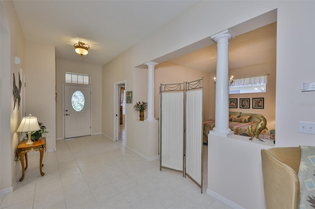 2128 Worthington Greens Dr, Sun City Center, FL 33573 - foyer entrance with ornate columns and baseboards