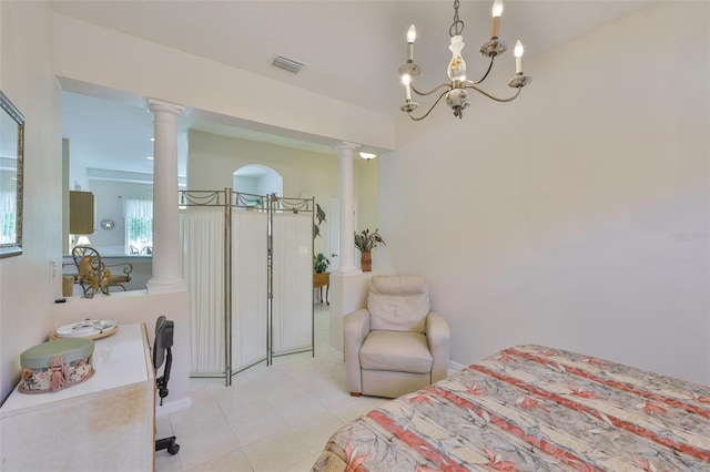 2128 Worthington Greens Dr, Sun City Center, FL 33573 - bedroom featuring decorative columns, light tile patterned floors, and a chandelier