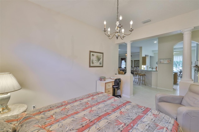 2128 Worthington Greens Dr, Sun City Center, FL 33573 - bedroom featuring ornate columns, a chandelier, and light colored carpet