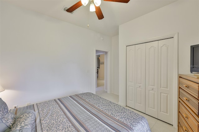 2128 Worthington Greens Dr, Sun City Center, FL 33573 - bedroom featuring a closet, ceiling fan, and light tile patterned flooring
