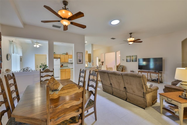 2128 Worthington Greens Dr, Sun City Center, FL 33573 - dining space featuring a ceiling fan, light tile patterned flooring, recessed lighting, and arched walkways