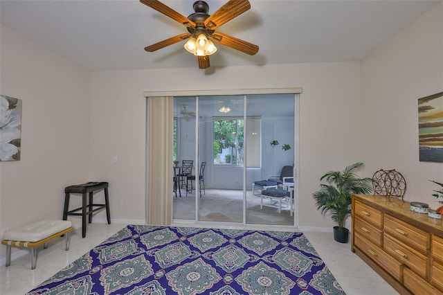 2128 Worthington Greens Dr, Sun City Center, FL 33573 - bedroom with access to outside, a ceiling fan, and baseboards