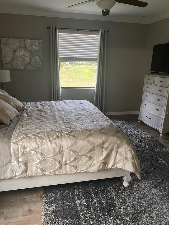 12619 Richezza Dr, Venice, FL 34293 - bedroom with ornamental molding, wood finished floors, a ceiling fan, and baseboards