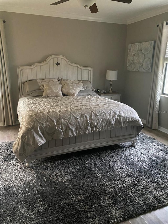 12619 Richezza Dr, Venice, FL 34293 - bedroom with wood finished floors, crown molding, baseboards, and a ceiling fan