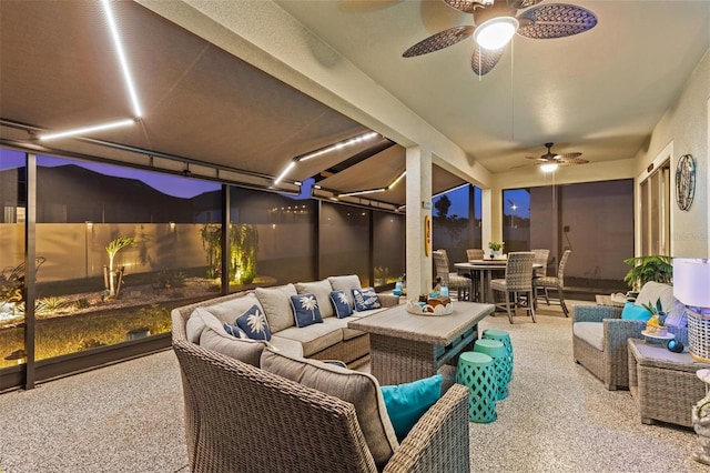 31921 Magna Gulf Loop, San Antonio, FL 33576 - patio at twilight featuring outdoor dining space, an outdoor hangout area, a ceiling fan, and a patio area