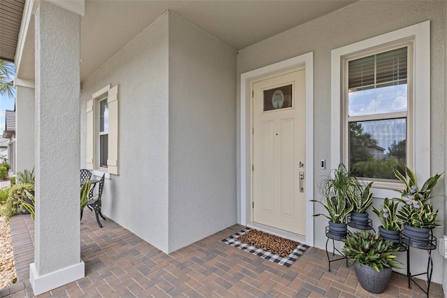 31921 Magna Gulf Loop, San Antonio, FL 33576 - doorway to property with stucco siding