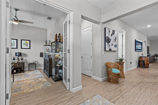 31921 Magna Gulf Loop, San Antonio, FL 33576 - hallway with baseboards, wood finished floors, and recessed lighting