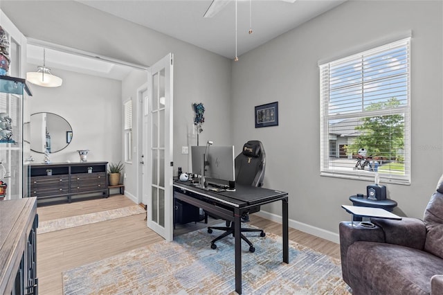 31921 Magna Gulf Loop, San Antonio, FL 33576 - office area featuring baseboards, wood finished floors, french doors, and a ceiling fan