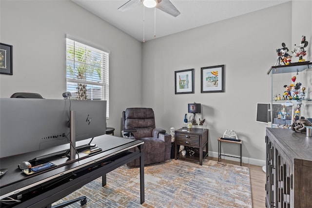 31921 Magna Gulf Loop, San Antonio, FL 33576 - home office with a ceiling fan, light wood-type flooring, and baseboards