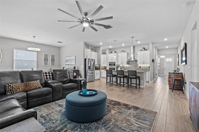 31921 Magna Gulf Loop, San Antonio, FL 33576 - living room with ceiling fan, light wood-style flooring, and recessed lighting