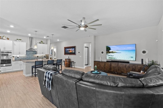 31921 Magna Gulf Loop, San Antonio, FL 33576 - living room with a ceiling fan, recessed lighting, and light wood-style floors