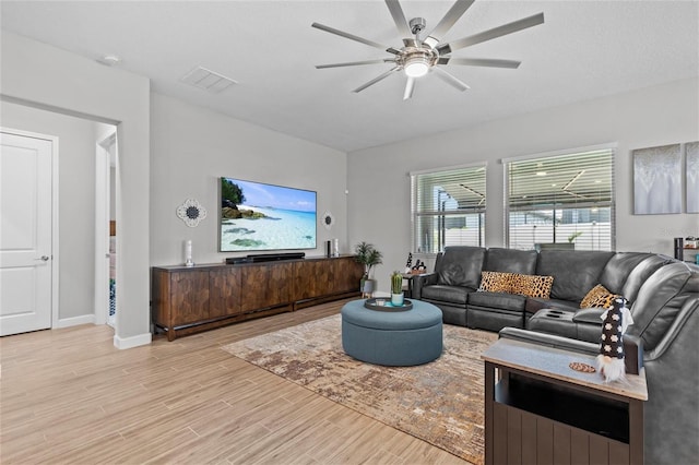 31921 Magna Gulf Loop, San Antonio, FL 33576 - living area with wood finished floors, a ceiling fan, and baseboards