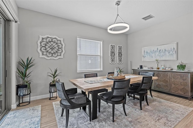31921 Magna Gulf Loop, San Antonio, FL 33576 - dining space featuring light wood finished floors and baseboards