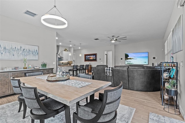 31921 Magna Gulf Loop, San Antonio, FL 33576 - dining area with light wood-type flooring and ceiling fan