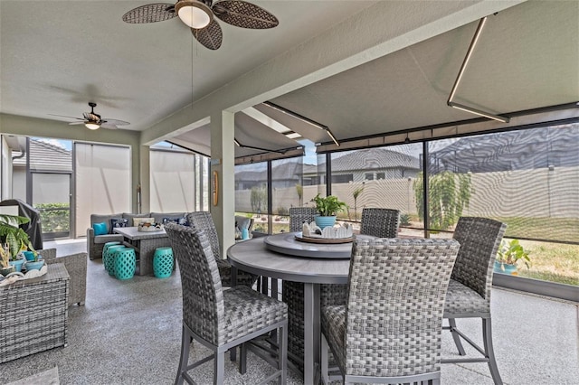 31921 Magna Gulf Loop, San Antonio, FL 33576 - sunroom / solarium with a ceiling fan, an outdoor hangout area, outdoor dining space, and carpet