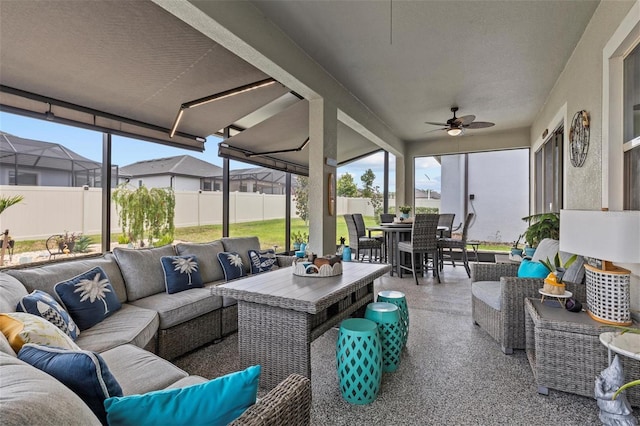 31921 Magna Gulf Loop, San Antonio, FL 33576 - sunroom with outdoor lounge area, outdoor dining space, and a ceiling fan