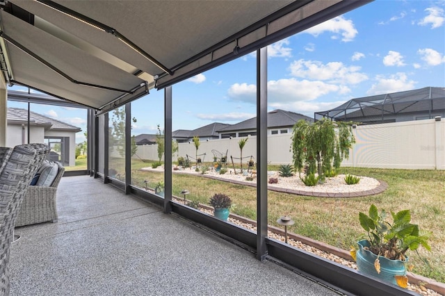 31921 Magna Gulf Loop, San Antonio, FL 33576 - sunroom / solarium featuring a residential view