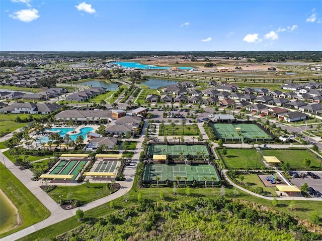 31921 Magna Gulf Loop, San Antonio, FL 33576 - aerial perspective of suburban area with a pool area and a nearby body of water