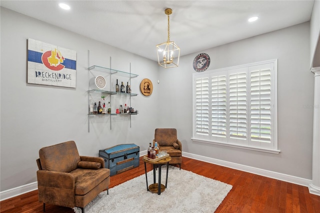 2011 Water Wheel Ct, Dunedin, FL 34698 - living area featuring a chandelier, baseboards, wood finished floors, recessed lighting, and a bar
