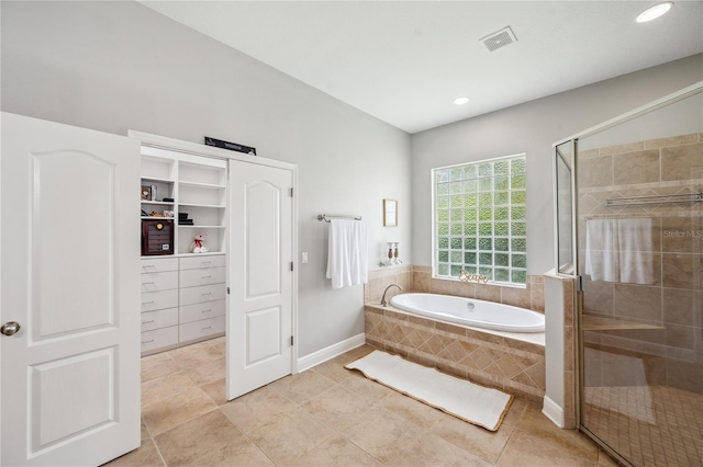 2011 Water Wheel Ct, Dunedin, FL 34698 - bathroom with a garden tub, a stall shower, recessed lighting, baseboards, and tile patterned flooring
