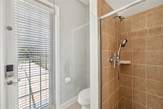 2011 Water Wheel Ct, Dunedin, FL 34698 - bathroom with a stall shower and toilet