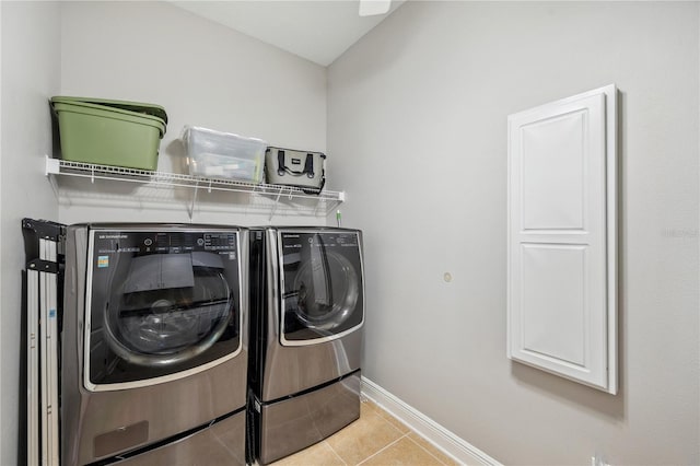 2011 Water Wheel Ct, Dunedin, FL 34698 - laundry room with washing machine and dryer, baseboards, and tile patterned flooring