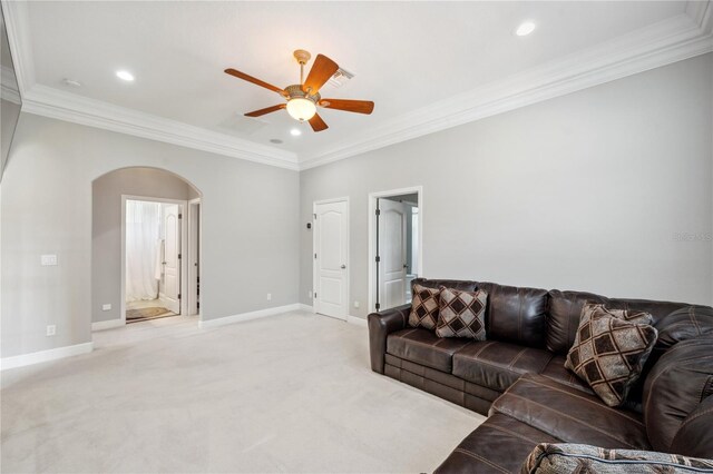 2011 Water Wheel Ct, Dunedin, FL 34698 - living area featuring a ceiling fan, arched walkways, ornamental molding, light colored carpet, and baseboards