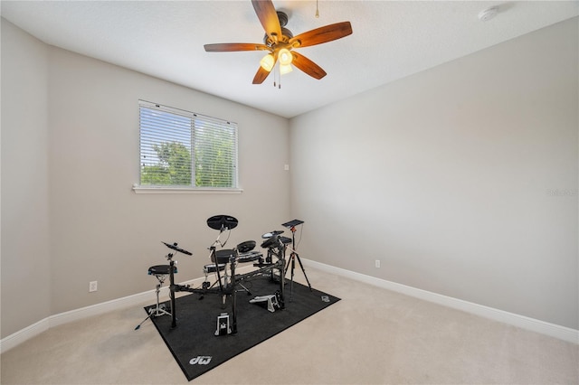 2011 Water Wheel Ct, Dunedin, FL 34698 - exercise area with light carpet, ceiling fan, and baseboards
