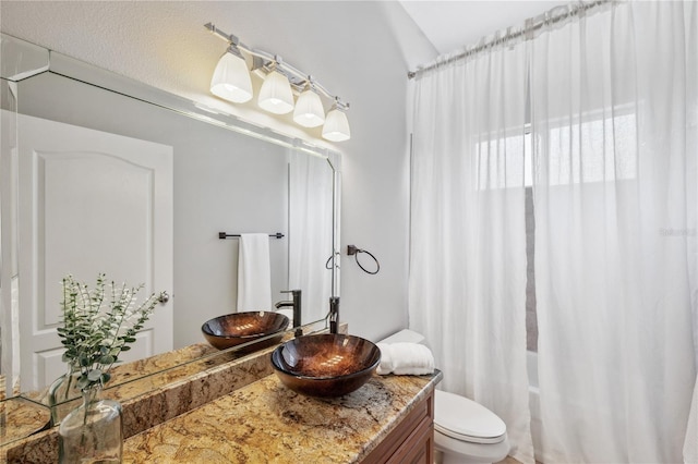 2011 Water Wheel Ct, Dunedin, FL 34698 - bathroom featuring vanity, shower / bath combination with curtain, and toilet