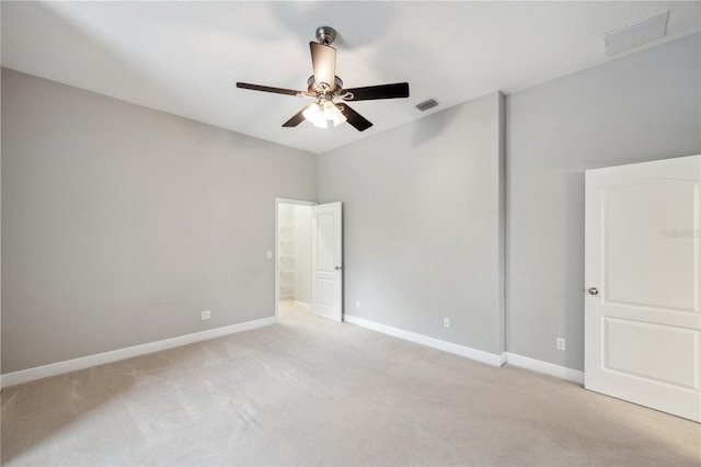 2011 Water Wheel Ct, Dunedin, FL 34698 - unfurnished bedroom featuring light carpet, baseboards, and ceiling fan