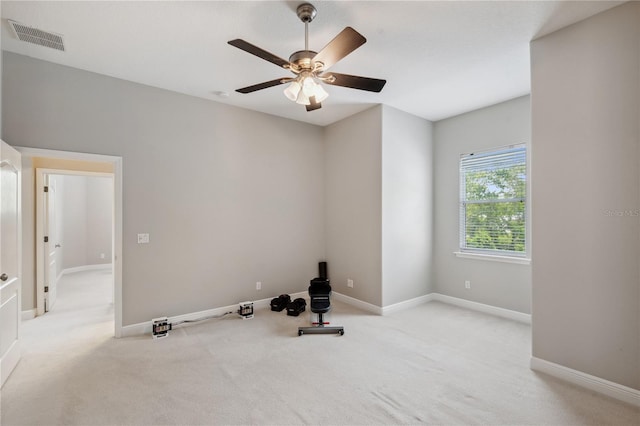 2011 Water Wheel Ct, Dunedin, FL 34698 - exercise area with carpet floors, a ceiling fan, and baseboards