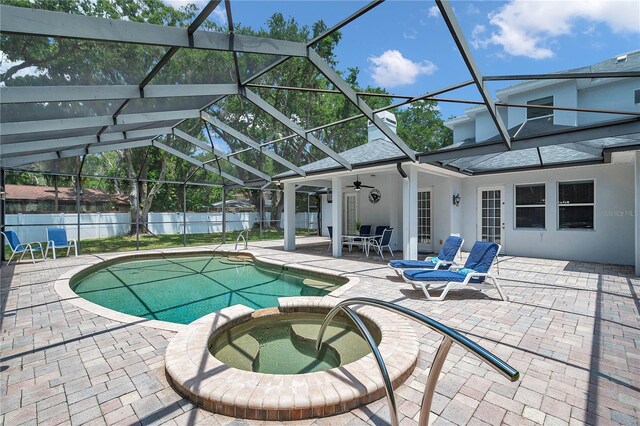 2011 Water Wheel Ct, Dunedin, FL 34698 - view of pool with a patio, a pool with connected hot tub, ceiling fan, and a lanai