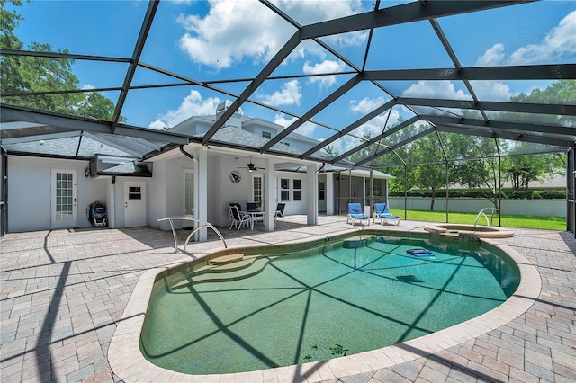 2011 Water Wheel Ct, Dunedin, FL 34698 - view of pool with a patio area, a ceiling fan, a pool with connected hot tub, and glass enclosure