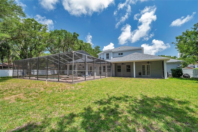 2011 Water Wheel Ct, Dunedin, FL 34698 - back of house with a ceiling fan, a patio area, french doors, glass enclosure, and stucco siding