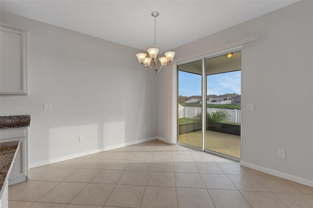 6211 114th Dr E, Parrish, FL 34219 - unfurnished dining area with a chandelier, baseboards, and light tile patterned floors
